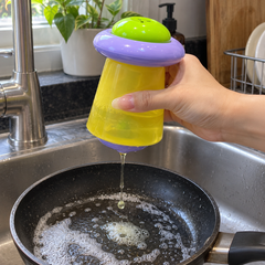 Liquid soap pouring from the bottom outlet into a pan