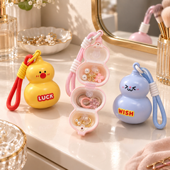 Pink Cute Gourd Mini Storage Keychain open on a vanity