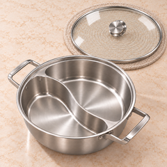 Empty divided cooking pot with the full-size glass lid placed flat