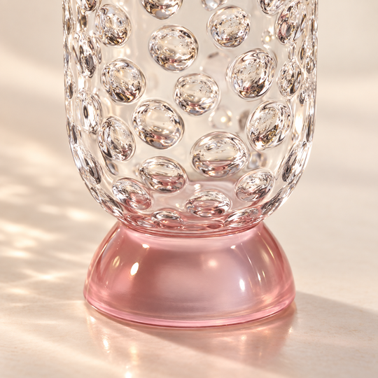 Close-up of clear raised bubbles and short pink pedestal base