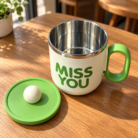 Cozy Sip Mug with its open metal interior and removable green lid