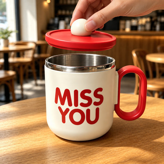 Red Cozy Sip Mug with lid lifted by the round knob