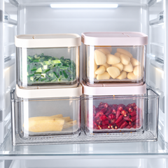 Flip-lid drain basket containers arranged in a refrigerator