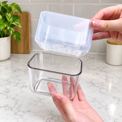 Removable draining insert lifted from clear outer container