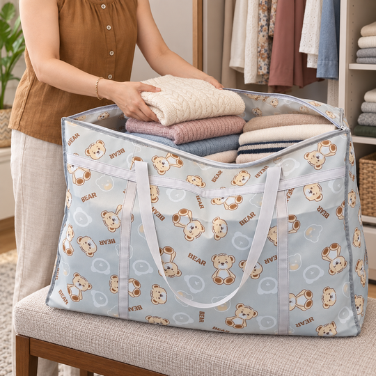 Placing folded clothes inside the Foldable Bear Storage Bag