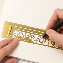 Tracing a cat shape with the Kitty Sketch Ruler