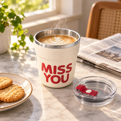 Red MISS YOU stainless steel cup with hot coffee