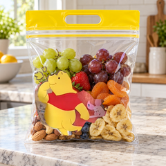 Pooh Bear handled bag filled with snacks