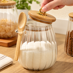 Hand lifting the ring lid of the ribbed glass jar