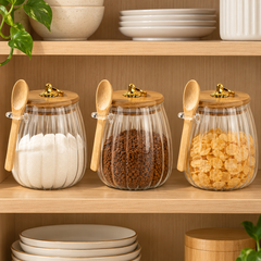 Three matching ribbed glass storage jars