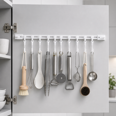 Organized kitchen utensils hanging from Sliding Kitchen Hooks