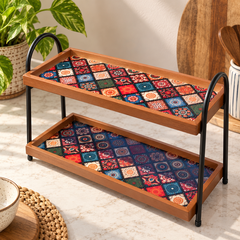 Vintage mosaic-pattern tray and black arched frame detail
