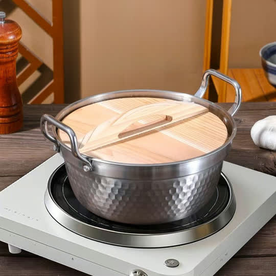 Wooden Lid Hammered Cooking Pot closed on stovetop
