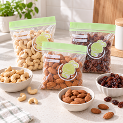 Separate bags of cashews, almonds and raisins
